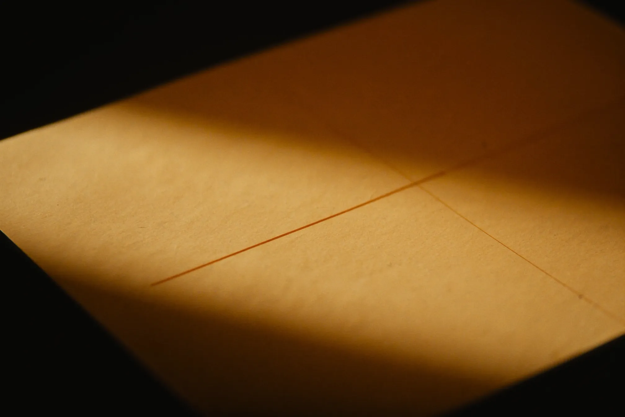 A session report laid out in warm light on a dark desk